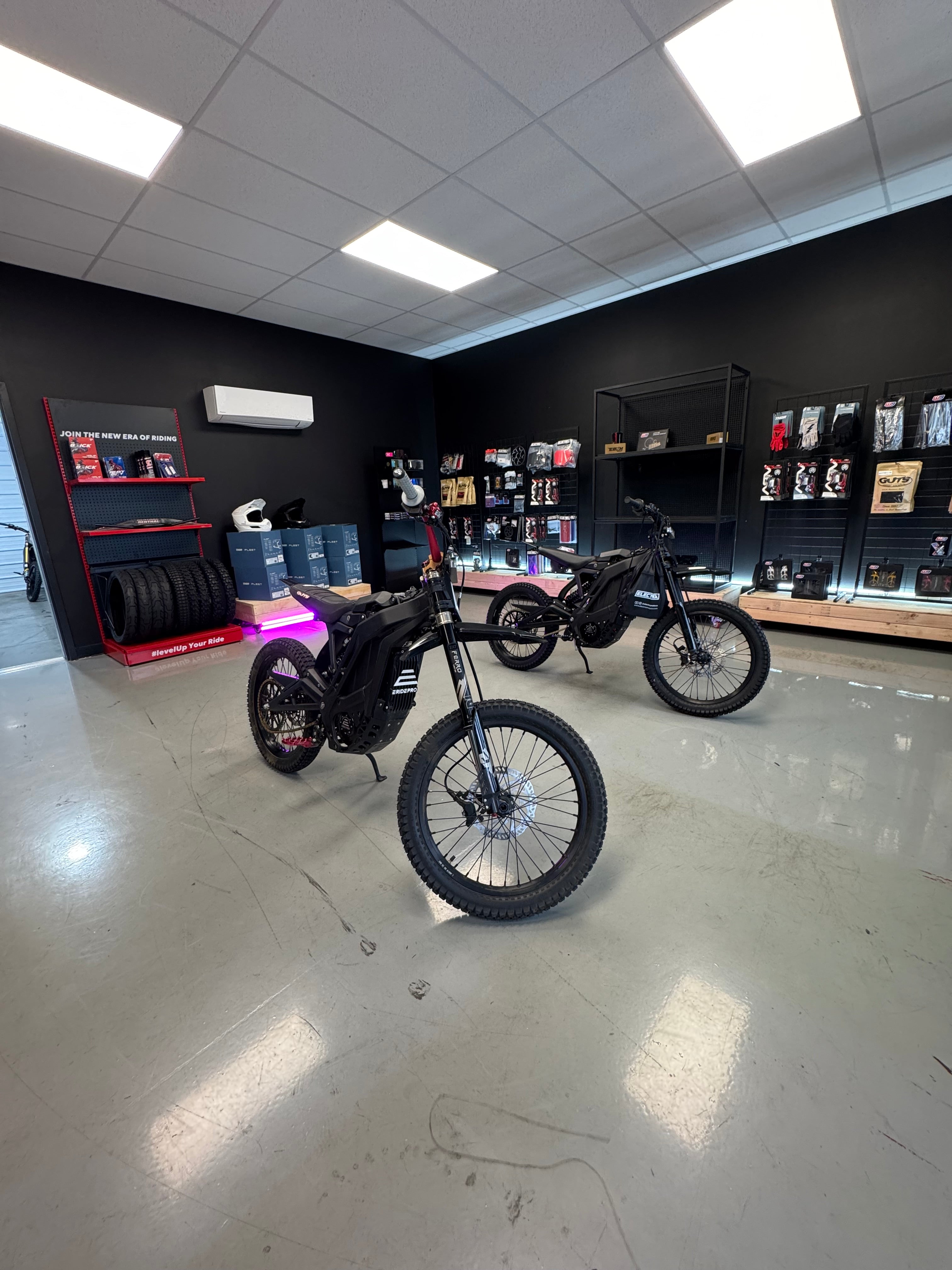 Interior of Electrix Moto store in Columbus, OH with ERide Pro SR and shelves of moto parts